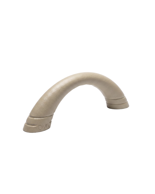 Ova Arch arch-shaped cast iron fitness weight in Sand, sculptural dumbbell, 2.5–5kg